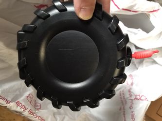 Tire shaped water bottle with red straw