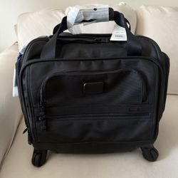 TUMI 4 wheeled carry on NEW w/tags 