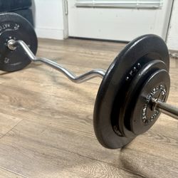 Standard Curl Bar With Pairs Of 25s, 10s And 5s. (Total: 96 lbs)