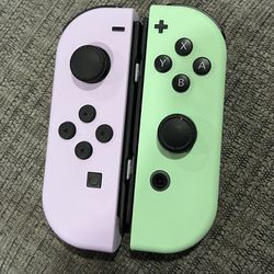 Lavender and light green nintendo switch joycons