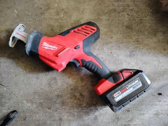 Hacksaw and battery