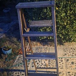 6 ft. vintage wooden A-frame step ladder equipped with a fold-out paint shelf.