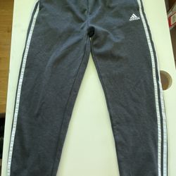 Grey Adidas joggers with white stripes #AdidasJoggers  Size: XL (18-20) 🚚 Ships fast – usually same or next day 🔥 Bundle & save – DM for deals on 2+
