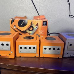 Gamecube consoles orange spice and silver ( complete ) have games as well if interested