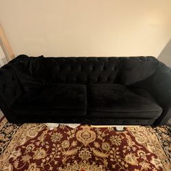 Black Chesterfield couch