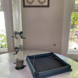2 Bird Feeders 1 Platform , 1 Tube Feeder Both Used in Good Condition $20 takes both
