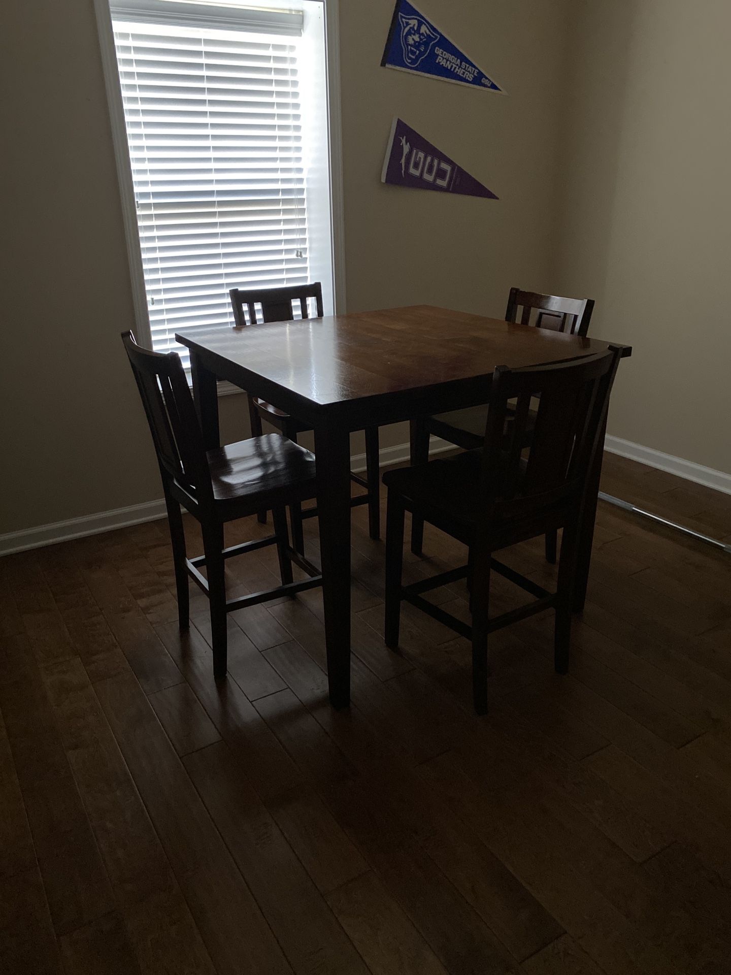 ***Gently Used Deep Wood High/Pub Table with 4 wooden chairs. In excellent condition. Has been cleaned with oil soak and polished with wood oil.