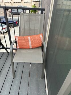 Two outdoor chairs and pillows