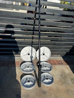 Weights Durable cast iron weight set includes two 45lb plates,  two 35lb plates,  two 25lb plates.  1 Olympic 7 foot bar 1 curl bar also 2 inch Olympi