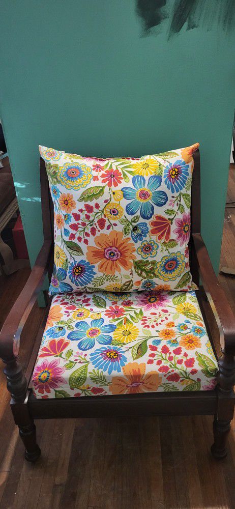 Wooden chair with new floral cushions that are interchangeable 