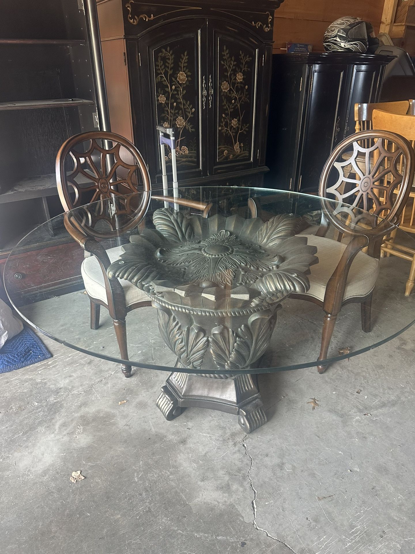 Gorgeous Bronze pedestal table with two spiderweb back chairs will sell separate