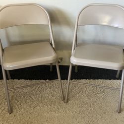 Pair of metal folding chairs