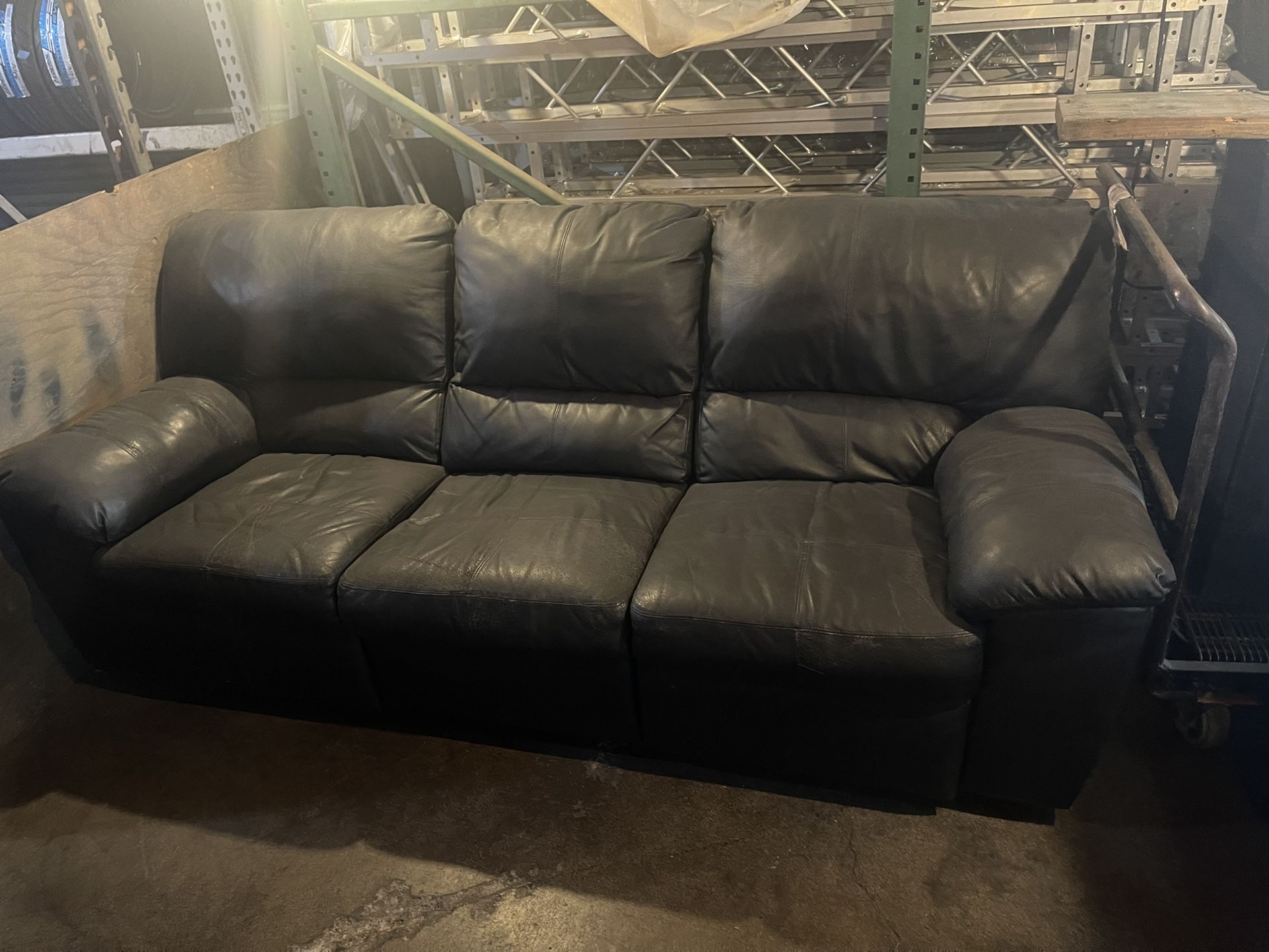 Used Black leather convertible sofa