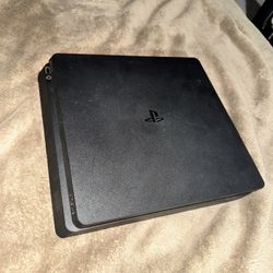 PS4 Slim (No controller) + 2 Games