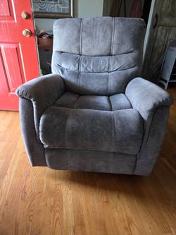 Electric power recliner with rocking and swivel features as well. It breaks down to 2 pieces for easy transportation. I believe we bought it from Ashl