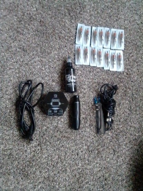 Tattooing Machine With Ink And Needles Still In Package