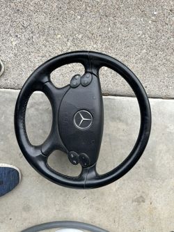 Mercedes-Benz E-Class (W211) or C-Class (W203)