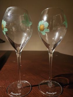 pair of genuine Perrier-Jouët crystal champagne glasses featuring the limited-edition green hummingbird and anemone flower design by artist Fernando L