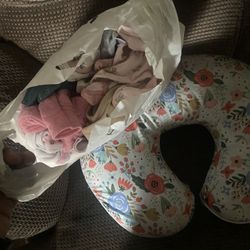 baby girl clothes and nursing pillow 