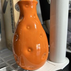 Small orange vase