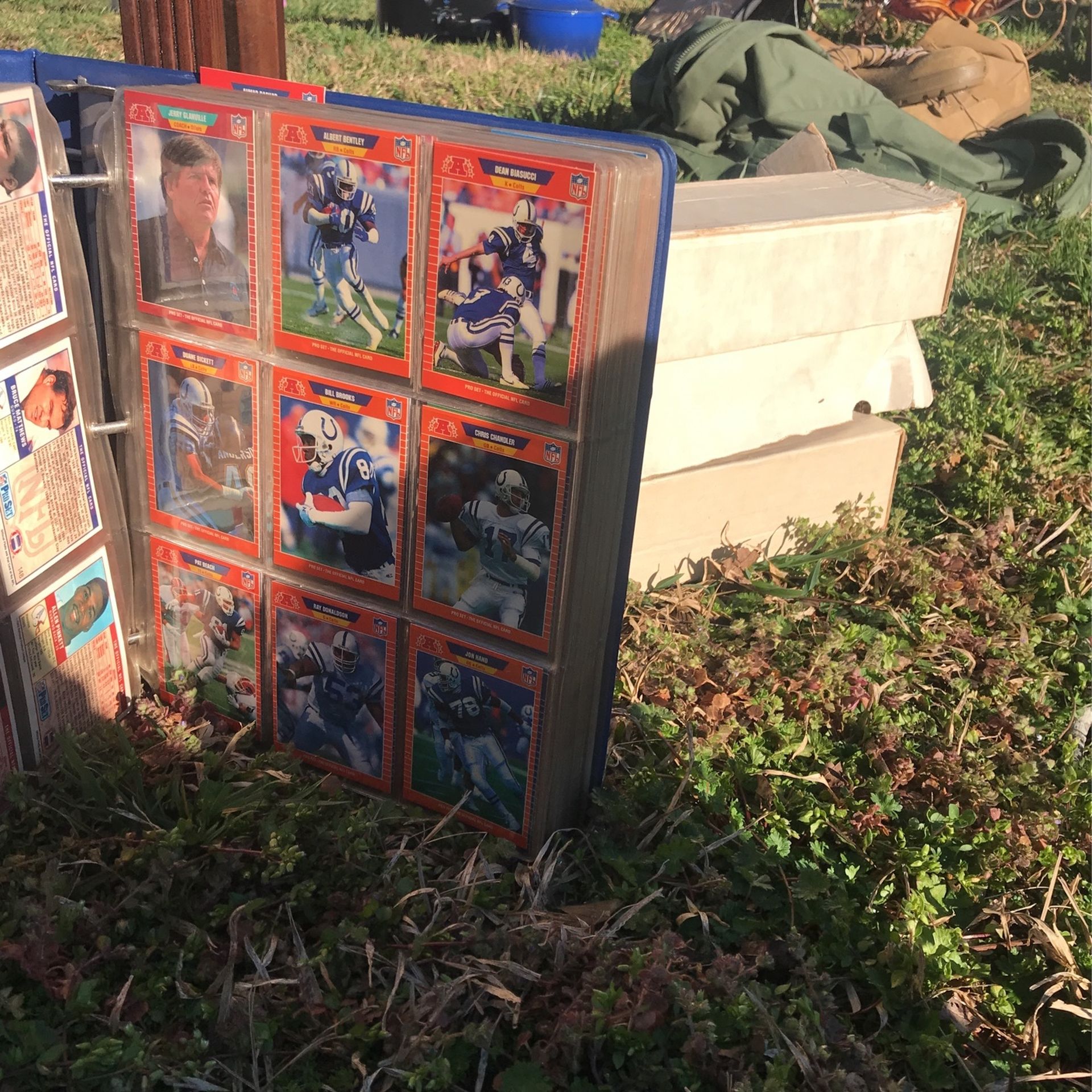 Football card collecting binder and three boxes of 250 cards each