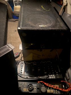 DJ Equipment Setup with Speaker Cabinet and Mixer