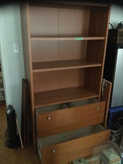 Bookcase . Attractive, around 7', Versatile with two file drawers adjusts for either letter or legal-size files. In bethesda.