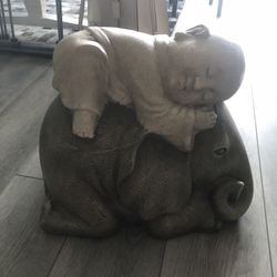 Monk on elephant statue