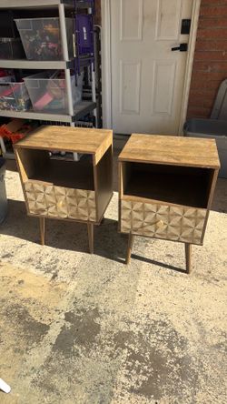Oak veneer with gold handles. One table has small damage but other than that, good shape.