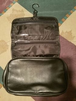 Black Make up Tote with hook for hanging. 2 small zippers & zipper around bag. ☺