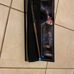 Harry potter’s wand with illuminating tip.