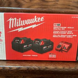 Two 5ah Milwaukee Battery And Charger