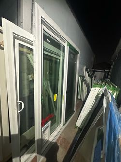 sliding patio door slidding door Vinyl material PRICE IS FIRM Height: 92 1/2 inches Width: 68 1/2 inches Brand new Double glass Has a doggy door