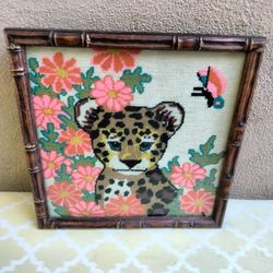 Leopard cub among flowers.. artwork