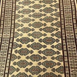 Antique Hand knotted tribal Bokhara wool rug Measures 33inch by 54 Inches 