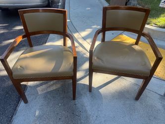 Two leather chairs and wood