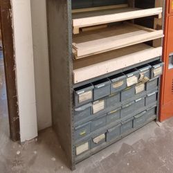 vintage industrial shelving unit with metal drawers