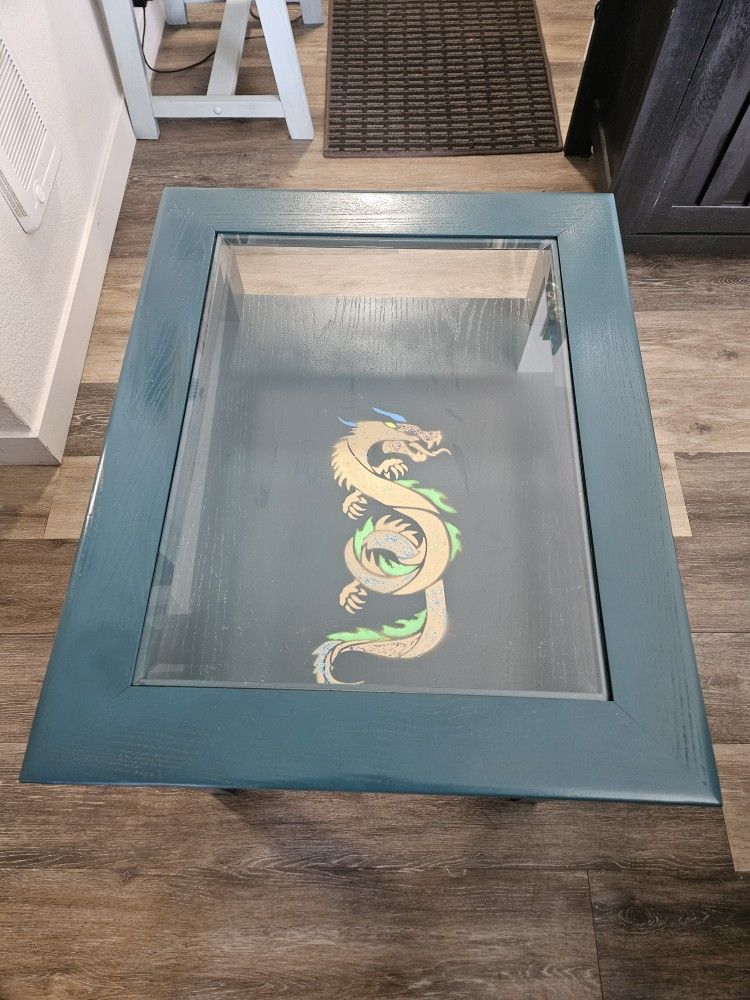 Wood glass top living room stand with glow in the dark Dragon design.