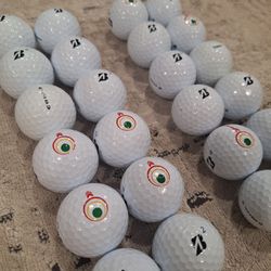 2 dozens + 25 extra balls of Bridgestone Tour B golf balls