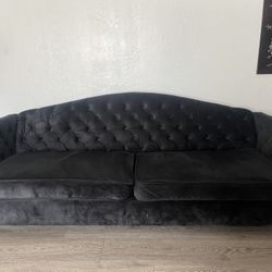 tufted black suede couch 