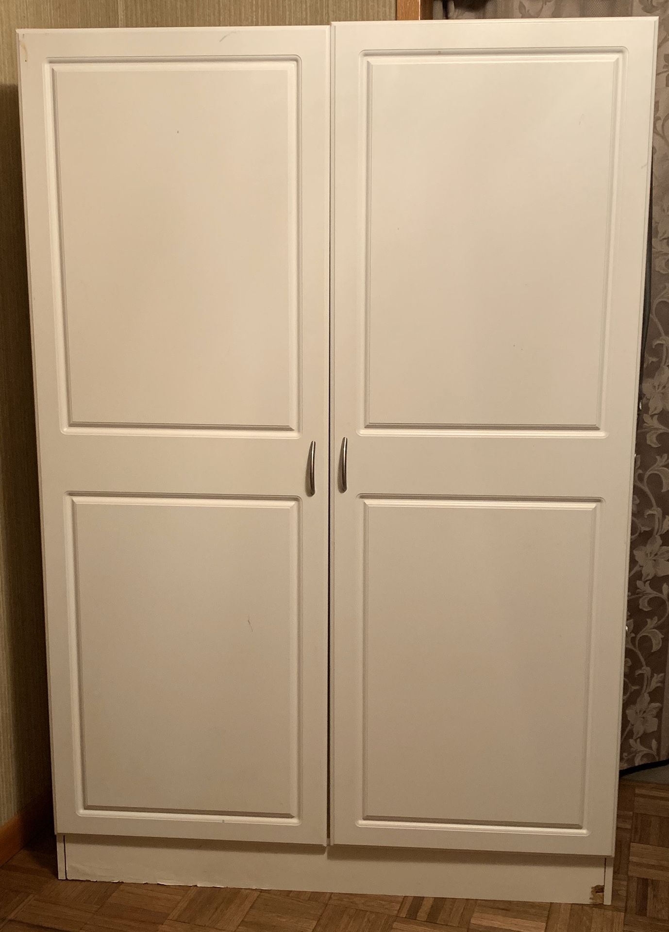 White storage closet with shelves & hanging rod