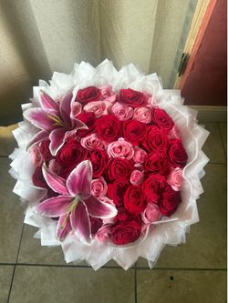 50 pink and red rose bouquet with lilys and lux wrap