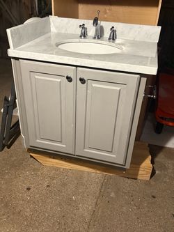 Used cabinet and marble top 30”x31