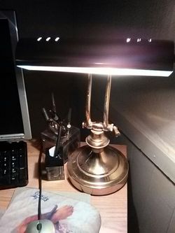 Brass desk lamp.