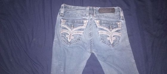 Ripped rock revival bootcut jeans size 28