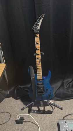 Transparent blue Jackson Dinky electric guitar JS series with made fretboard