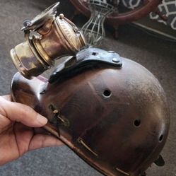 miner's helmet with antique lamp in good condition