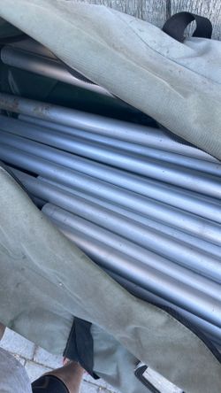 Poles and brackets for a tent