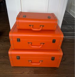 3 piece vintage-style, bright orange, nesting - storage trunk suitcases.