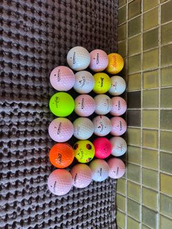23 used mixed golf balls
